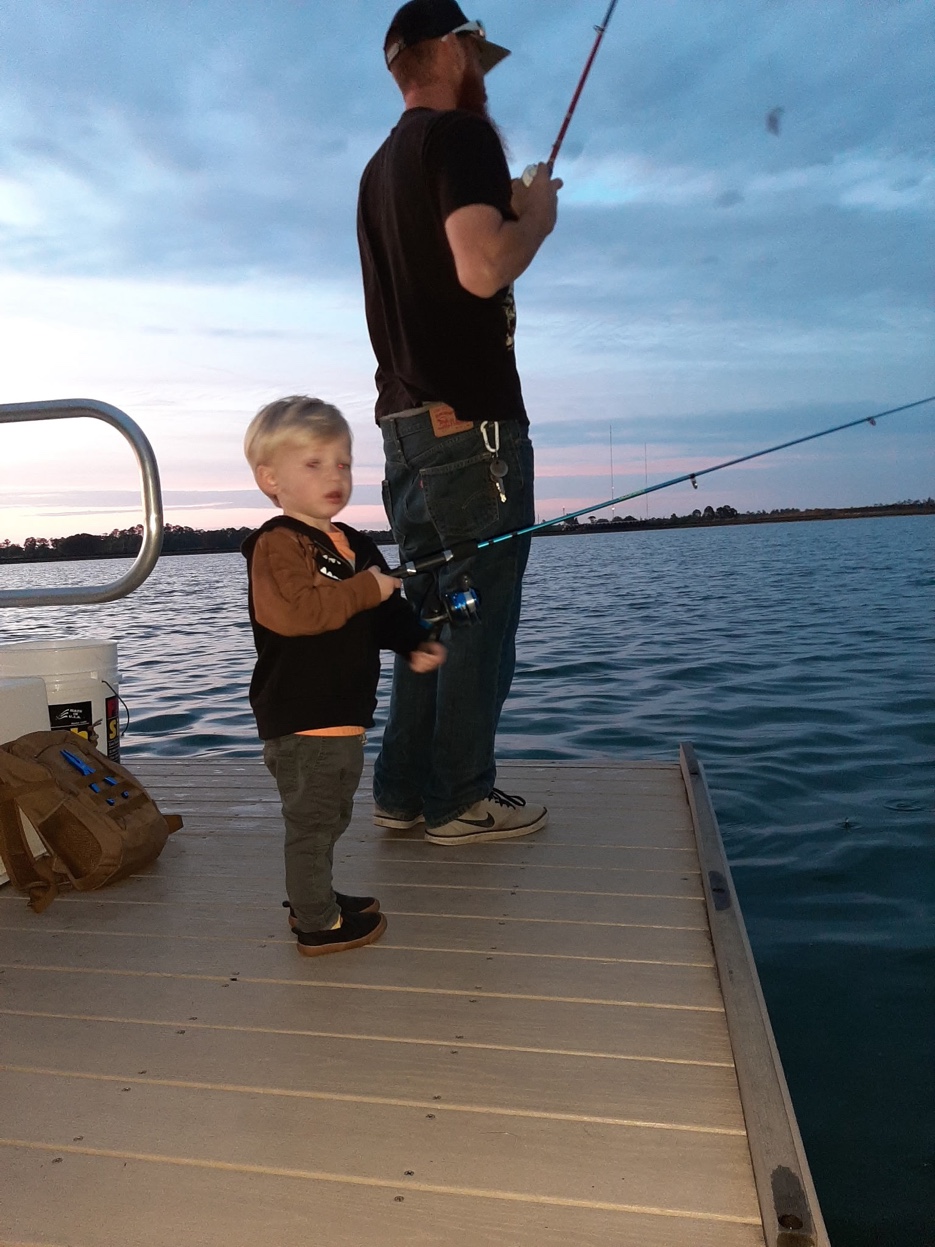 Maxwell fishing with his son
